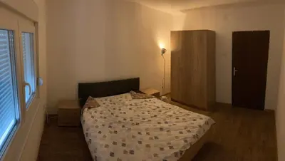 a bedroom with a bed and a window at villa Antonijevic in Brestovac