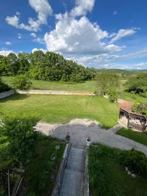 an aerial view of a yard with a large field at villa Antonijevic in Brestovac