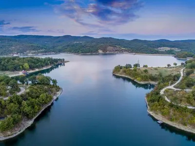 an aerial view of a large river with trees at villa Antonijevic in Brestovac