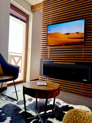 a living room with a large flat screen tv at Mr Alek - Luxury Apartment Kopaonik in Kopaonik