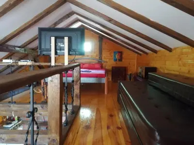 a room with a bed in a attic at Galerija68 in Kraljevo