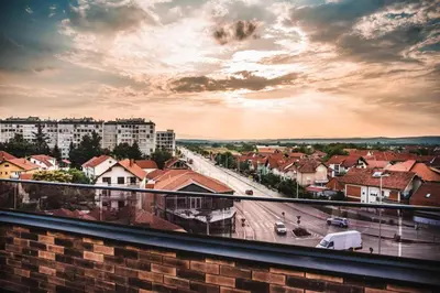 a view of a city from a balcony at Sky apartmani & spa-Vip Lux DOO in Leskovac