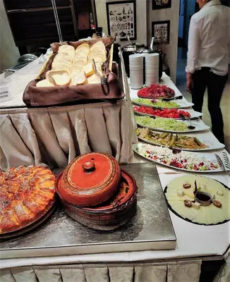 a buffet with many different types of food on a table at Milmari - Breakfast and pool in Kopaonik