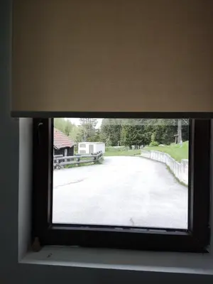 a window with a view of a driveway at Studios Šumska Kuća 2 & 3 in Kopaonik