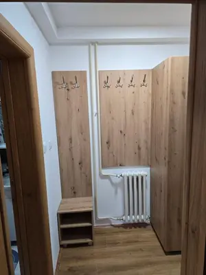 a room with wooden walls and a window and a radiator at Studios Šumska Kuća 2 & 3 in Kopaonik