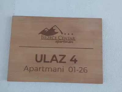 a wood sign with the name of arucklezgargarorp istg at Brzeće Center Studio Mitrovski Gondola 300m in Kopaonik