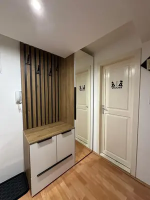 a room with a closet and two doors at Čarapan in Kruševac