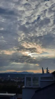 a view of a cloudy sky from a building at Loft apartman in Jagodina
