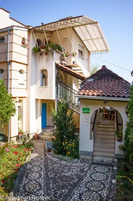 a building with a staircase in front of it at Apartman Ristovic in Vrnjačka Banja