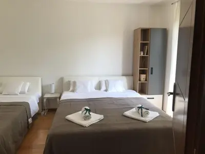 a bedroom with two beds with towels on them at Apartman Djordjevići in Vrnjačka Banja