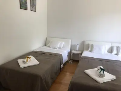 two beds in a room with towels on them at Apartman Djordjevići in Vrnjačka Banja
