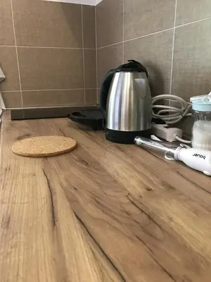 a counter top with a tea kettle on a wooden floor at Apartman Djordjevići in Vrnjačka Banja