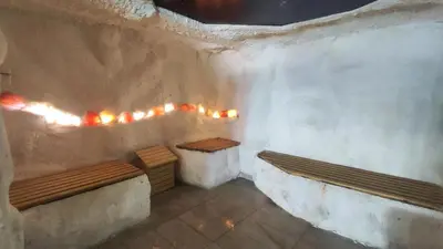 a room with two benches and lights on the wall at Snow peak Wellness & Spa, Kopaonik Milmari N5 in Kopaonik