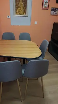 a conference room with a wooden table and chairs at suvi centar in Niš
