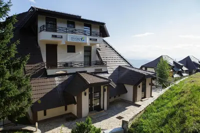 a row of houses with roofs on a hill at Dvori Sky View E13 Kopaonik - free private parking in Kopaonik