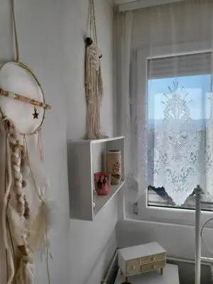 a white room with a window and a shelf at Happy Place in Niš