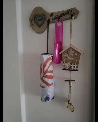 a door with a shelf with a pink bottle on it at Happy Place in Niš