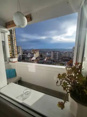 a window with a view of a city at Happy Place in Niš