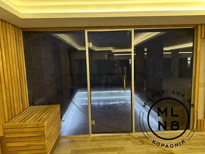 a glass door to a gym with a sign on it at Milmari Lux N8 in Kopaonik