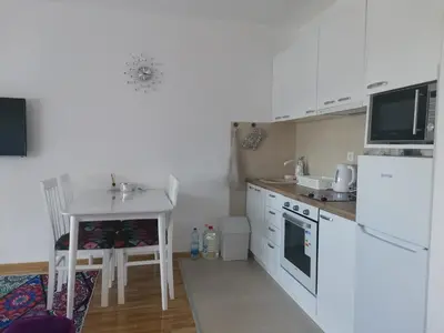 a kitchen with a sink and a white refrigerator at Bellavista in Vrnjačka Banja