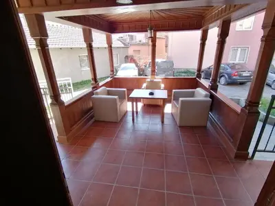 a view of a porch with chairs and a table at MON Accommodation free parking in Niš