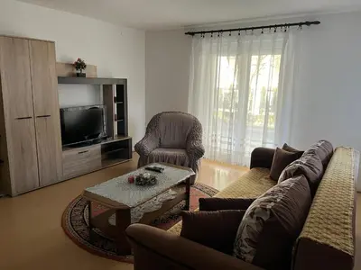 a living room with a couch and a tv at Smestaj Miki in Soko Banja