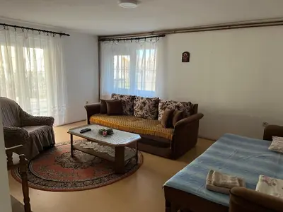 a living room with a couch and a table at Smestaj Miki in Soko Banja