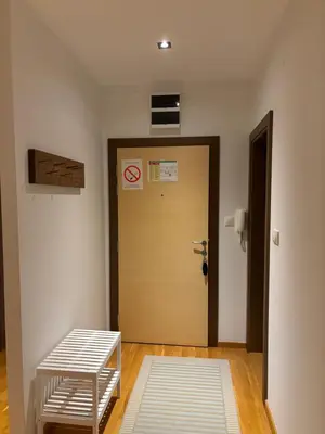 a room with a door and a stool in front of it at BRZECE SKI GONDOLA & FREE PARKING apartment in Kopaonik