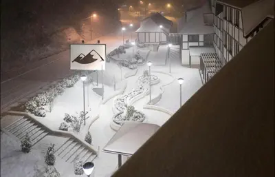 a skate park with snow on the ground at night at BRZECE SKI GONDOLA & FREE PARKING apartment in Kopaonik