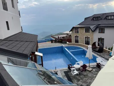 a view of a swimming pool on top of a building at Apartman Pahuljica in Kopaonik