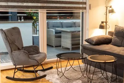 a living room with a couch and chairs and a table at IN LUX SPA APARTMAN in Vrnjačka Banja