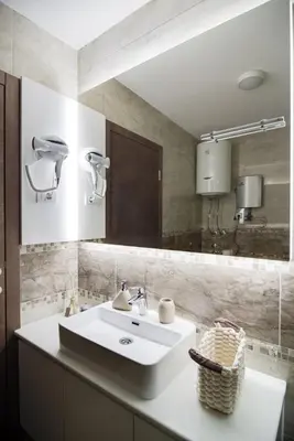 a bathroom with a white sink and a mirror at IN LUX SPA APARTMAN in Vrnjačka Banja