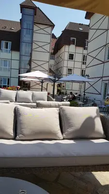 a group of white pillows sitting on top of a bed at Čar30 Kraljevi čardaci in Kopaonik