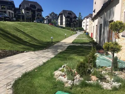 a street in a residential neighborhood with houses at L&N Apartmani Kopaonik-Milmari Resort in Kopaonik