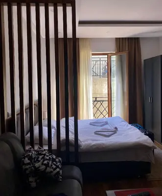 a bedroom with a bed with a large crib at Apartman Milosavljevic-President Kop in Kopaonik