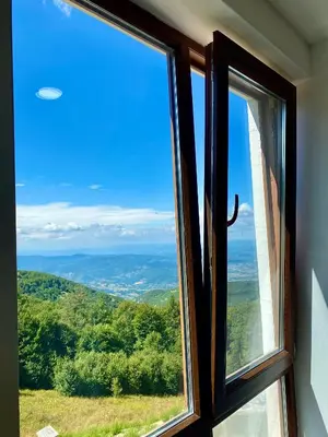 a window with a view of the mountains at Apartman Milosavljevic-President Kop in Kopaonik