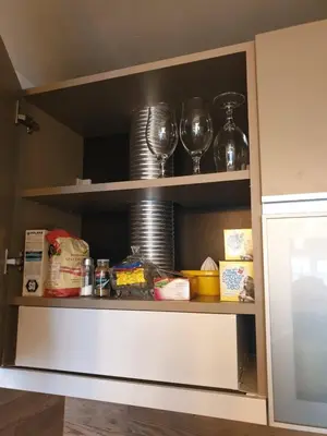 a pantry cabinet with plates and dishes on it at Milmari Premier40 in Kopaonik