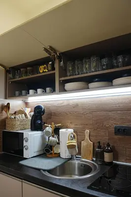 a kitchen counter with a sink and a microwave at VitaDea Milmari Kopaonik in Kopaonik
