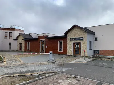 an empty parking lot in front of a building at Milmari Premier05 in Kopaonik
