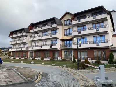 a large building with balconies on the side of it at Milmari Premier05 in Kopaonik
