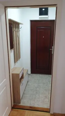 a door leading into a room with a kitchen at Apartman Ristić 6 in Soko Banja
