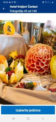 a plate of fruit and vegetables on a table at apartman Kraljevi čardaci Sadikovic sa garažom in Kopaonik