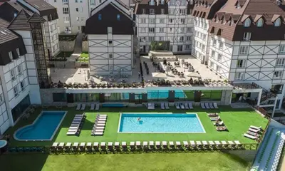arial view of a large building with a swimming pool at Apartman Kraljevi cardaci 5b-32 in Kopaonik