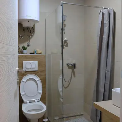 a bathroom with a toilet and a shower at Ski & Spa Apartment N34 Milmari Resort Kopaonik in Kopaonik