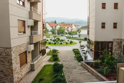 an aerial view of a courtyard between two buildings at Apartman DreamHome in Vrnjačka Banja