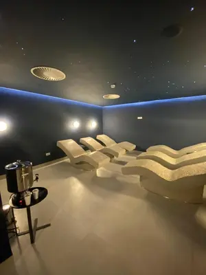a room with a row of chairs and a table at Apartman DreamHome in Vrnjačka Banja