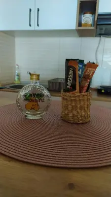 a glass jar and a basket on a table at Apartman Draškovic - Goč in Biserske Kuće