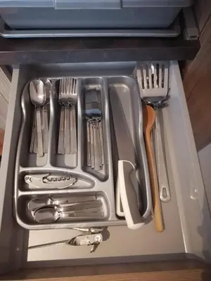 a drawer filled with utensils in a kitchen at Bela Jela - Brzeće, Kopaonik in Brzeće