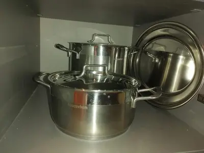 a pair of metal pots sitting on top of a stove at Bela Jela - Brzeće, Kopaonik in Brzeće