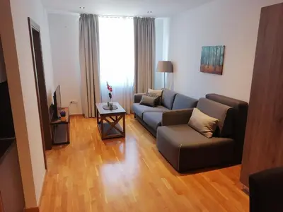 a living room with a couch and a table at Bela Jela - Brzeće, Kopaonik in Brzeće